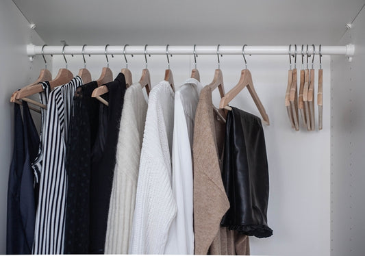 Capsule wardrobe in closet showcasing essentials